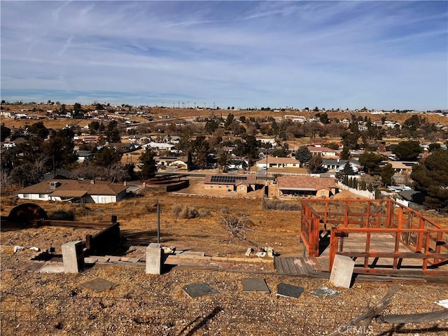 birds eye view of property with a residential view