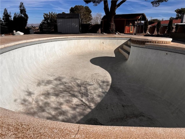 view of swimming pool featuring an empty pool