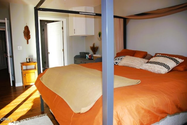 bedroom featuring dark hardwood / wood-style flooring