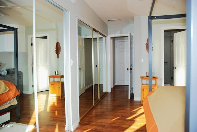 hallway featuring dark wood-type flooring