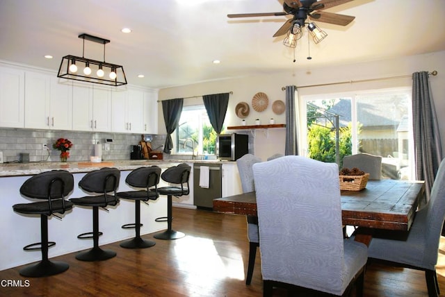 dining room featuring dark wood-type flooring and ceiling fan