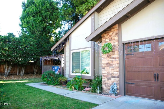 view of home's exterior featuring a garage and a lawn