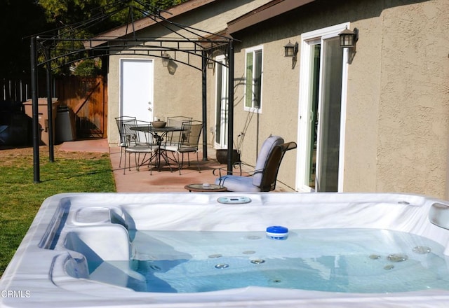 view of patio with a gazebo and a hot tub