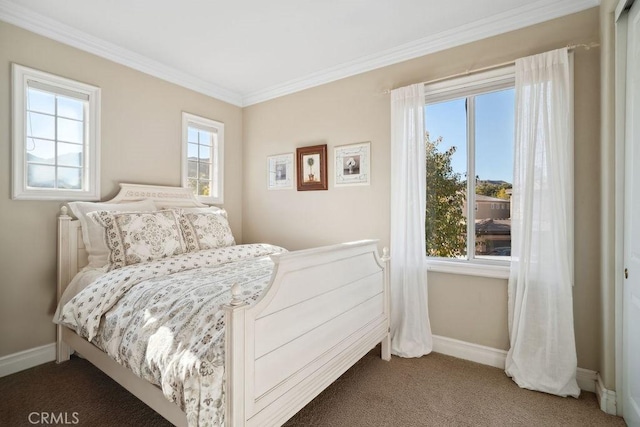 bedroom featuring carpet flooring, ornamental molding, and multiple windows