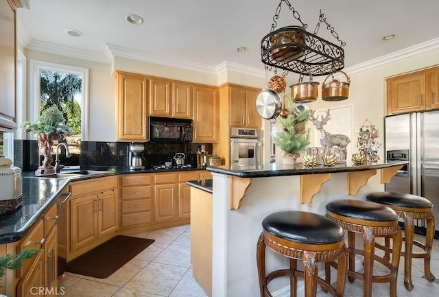 kitchen with light tile patterned floors, appliances with stainless steel finishes, ornamental molding, pendant lighting, and sink