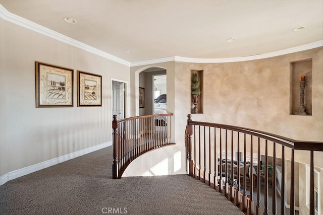 hallway featuring carpet floors and ornamental molding