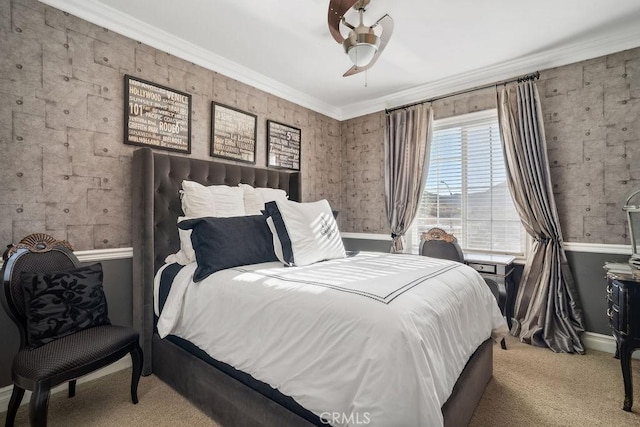 bedroom featuring ceiling fan, ornamental molding, and carpet flooring