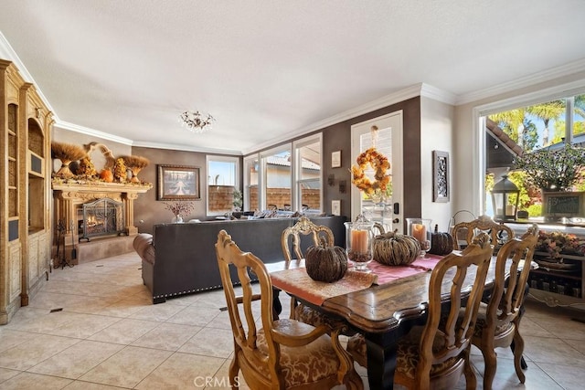 dining space featuring crown molding and light tile patterned flooring