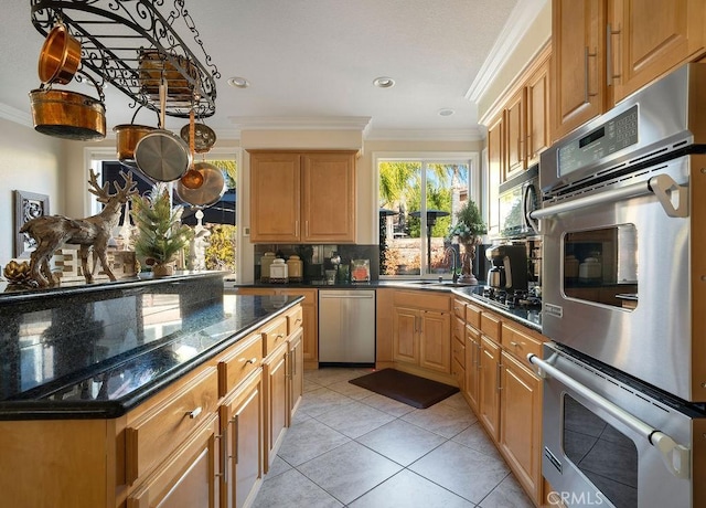 kitchen featuring tasteful backsplash, black appliances, light tile patterned flooring, crown molding, and dark stone counters