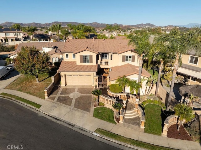 view of front of home featuring a mountain view and a garage