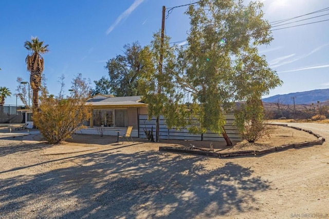 view of front of property with a mountain view