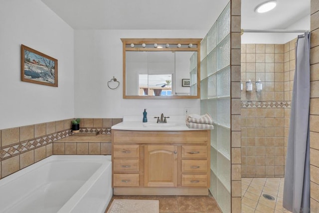 bathroom featuring vanity, tile patterned flooring, and independent shower and bath