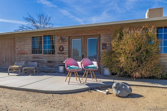 rear view of property featuring a patio area