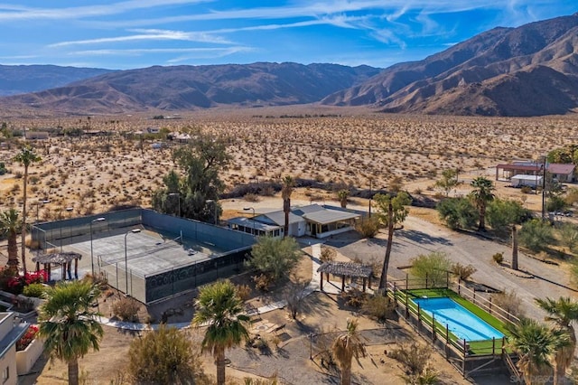 birds eye view of property featuring a mountain view