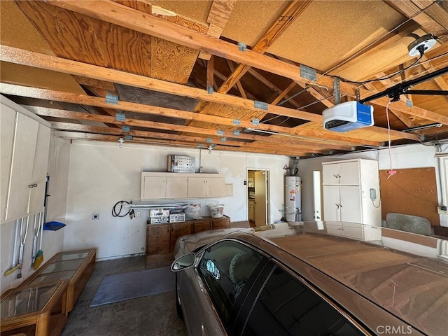 garage featuring a garage door opener and strapped water heater