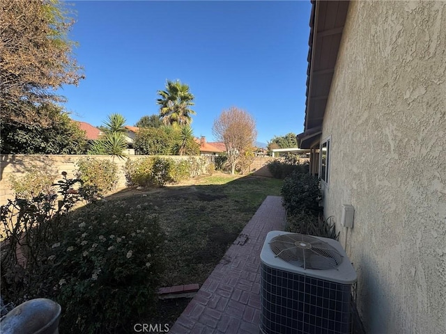 view of yard with central AC unit