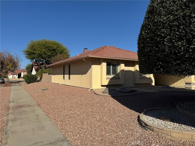 view of side of home with a patio