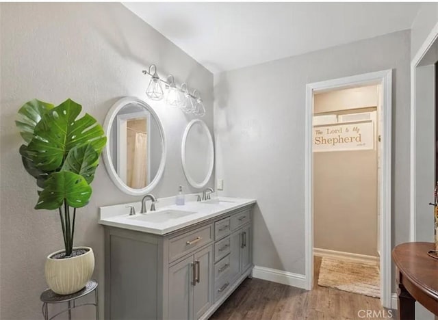 bathroom featuring vanity and wood-type flooring