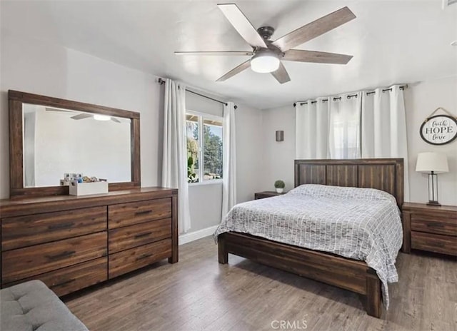 bedroom featuring ceiling fan and hardwood / wood-style floors