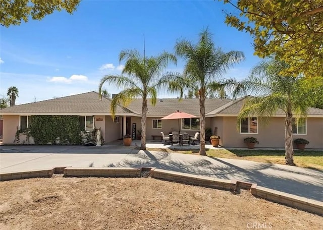 single story home with a patio area and outdoor lounge area