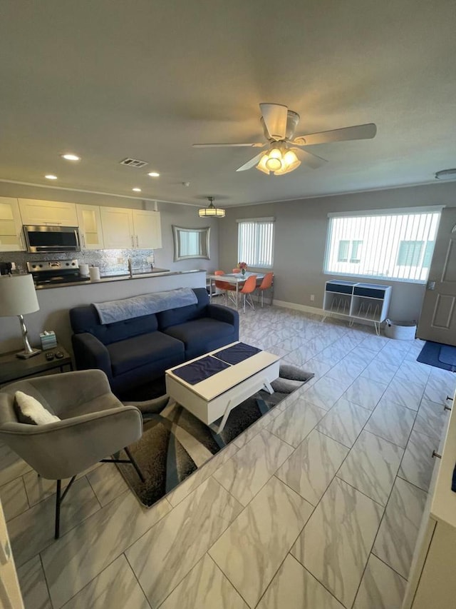 living room featuring ceiling fan