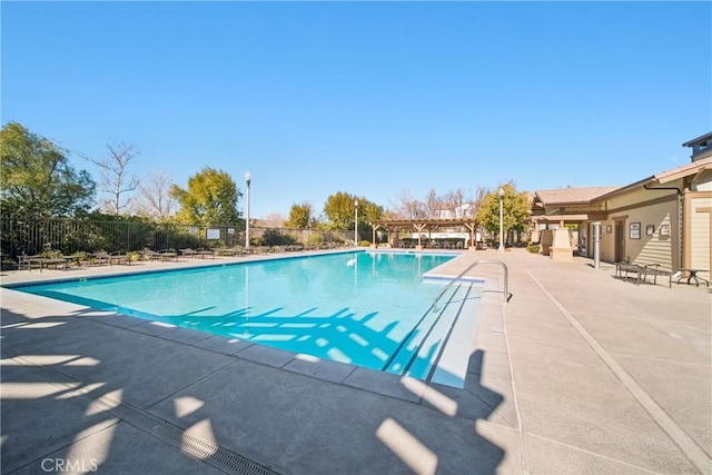 view of swimming pool featuring a patio area