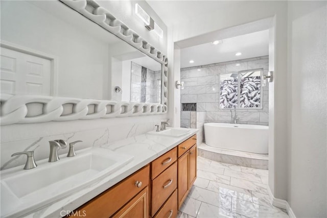 bathroom featuring a bathing tub and vanity