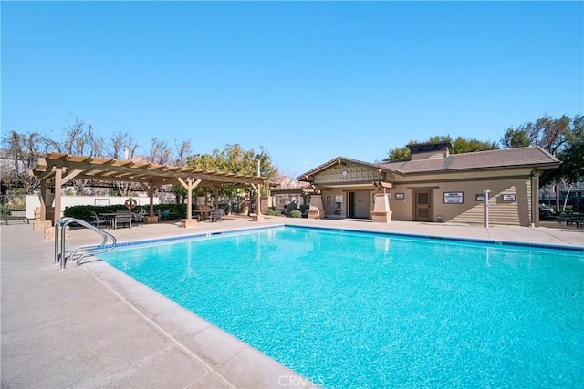 view of swimming pool featuring a pergola and a patio