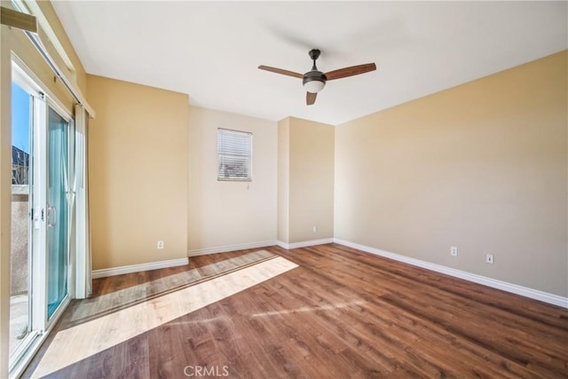 spare room with ceiling fan and hardwood / wood-style flooring