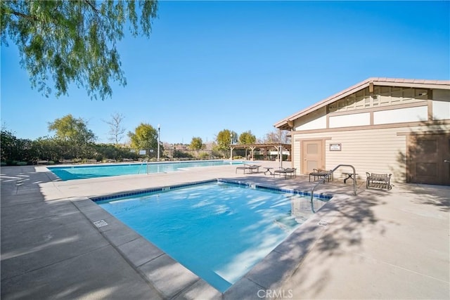 view of swimming pool featuring a patio