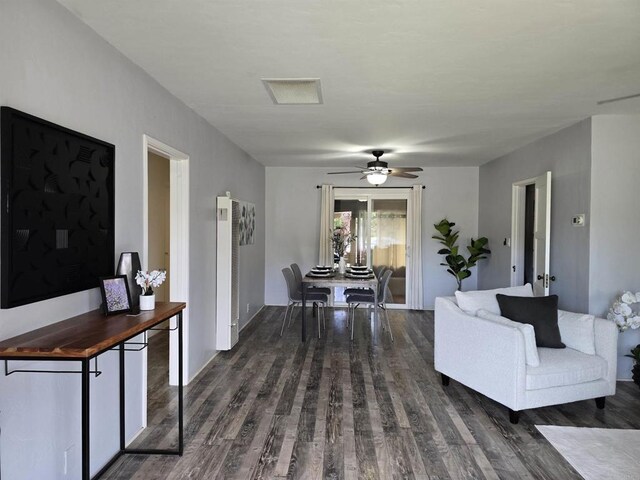 2416 J Ave, National City, CA 91950 - living area featuring dark wood-type flooring, ceiling fan, and a heating unit