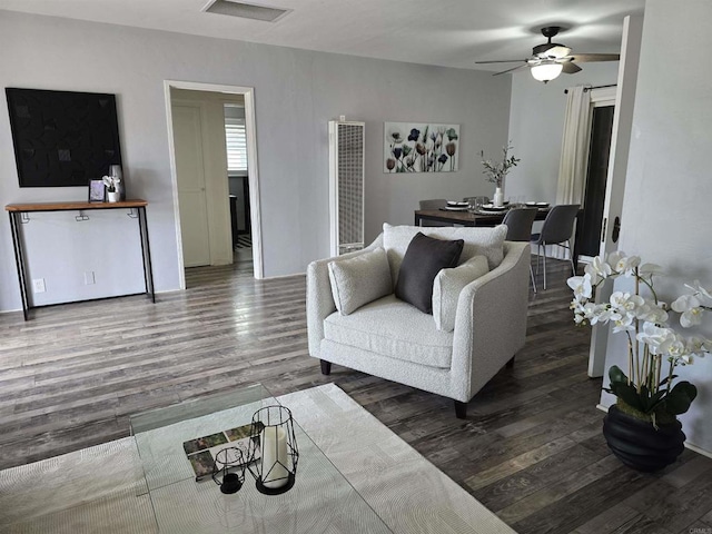 2416 J Ave, National City, CA 91950 - living room with a heating unit, wood finished floors, a ceiling fan, and baseboards