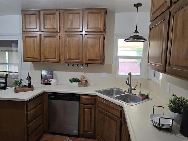2416 J Ave, National City, CA 91950 - kitchen featuring dishwasher, a sink, light countertops, and pendant lighting