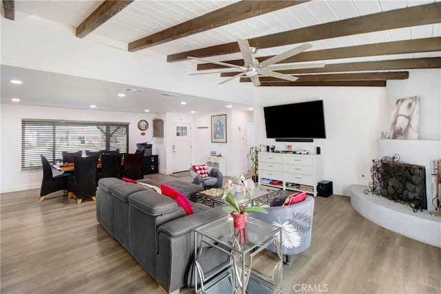 living room featuring light hardwood / wood-style floors, wood ceiling, lofted ceiling with beams, and ceiling fan