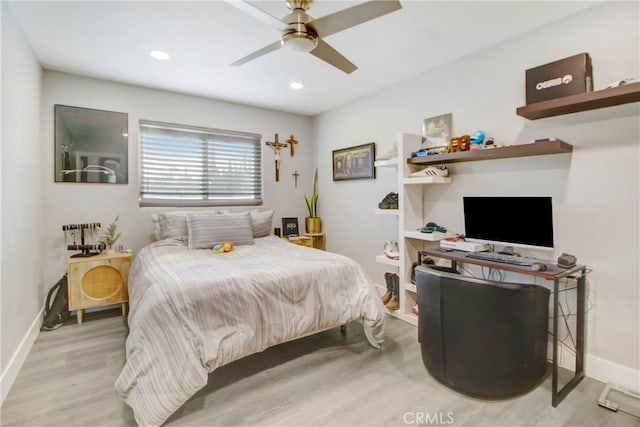 bedroom featuring ceiling fan and light hardwood / wood-style flooring