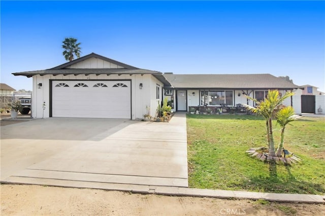 ranch-style home featuring a garage and a front yard