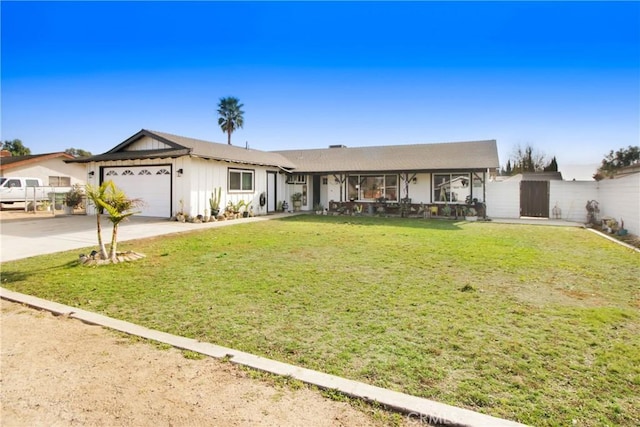 single story home with a garage and a front lawn