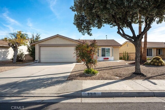 single story home featuring a garage