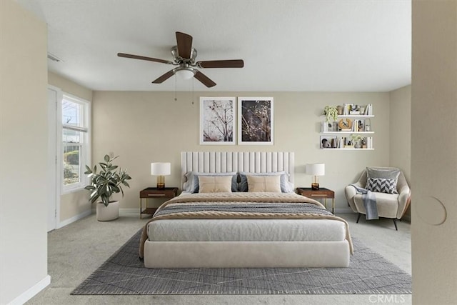 carpeted bedroom featuring ceiling fan