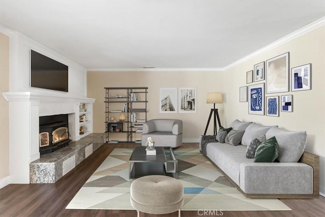 living room with wood-type flooring and ornamental molding