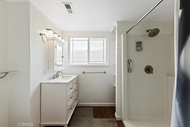 bathroom with vanity and curtained shower