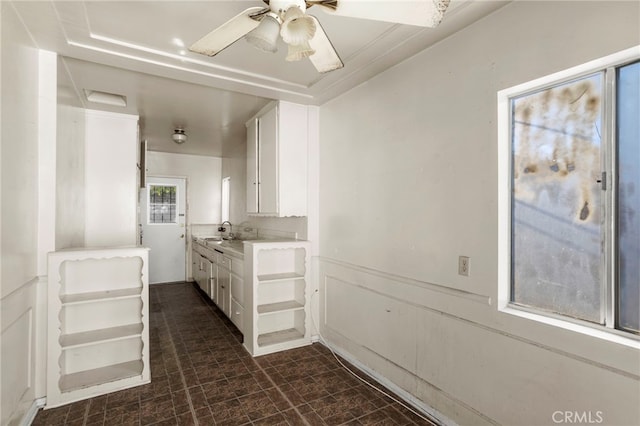 bathroom with ceiling fan and vanity