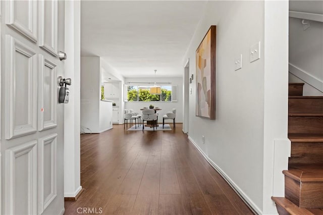 corridor featuring dark hardwood / wood-style flooring