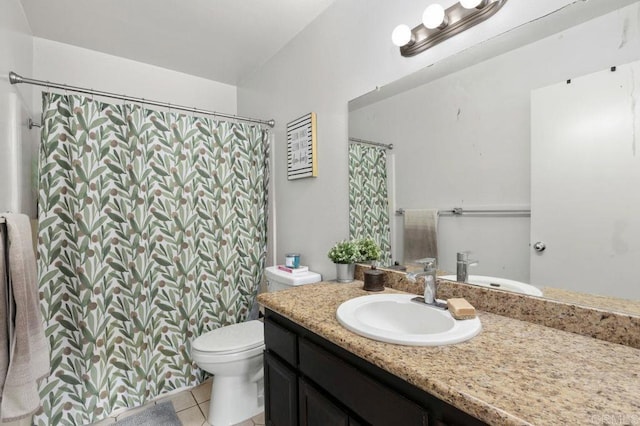 bathroom with tile patterned floors, vanity, and toilet