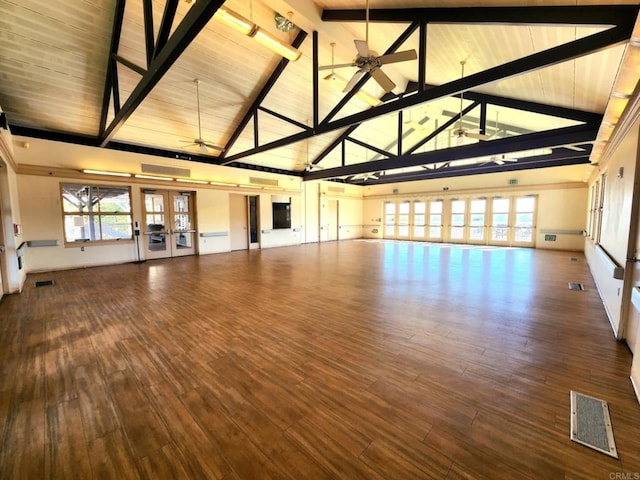 unfurnished living room featuring french doors, beamed ceiling, ceiling fan, hardwood / wood-style flooring, and high vaulted ceiling