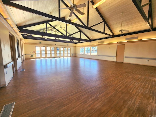 unfurnished room featuring wood ceiling, dark hardwood / wood-style flooring, high vaulted ceiling, ceiling fan, and beam ceiling