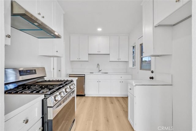 kitchen with sink, extractor fan, stainless steel gas stove, white cabinetry, and dishwasher