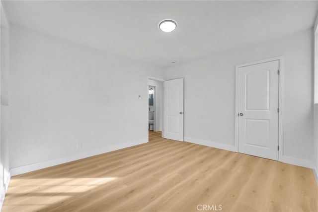 unfurnished room featuring light hardwood / wood-style flooring