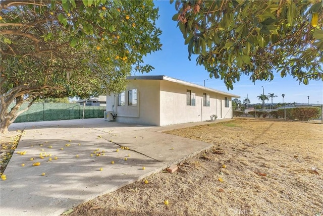 view of home's exterior with a patio