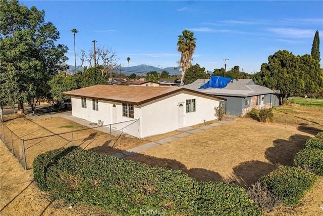 rear view of property featuring a mountain view